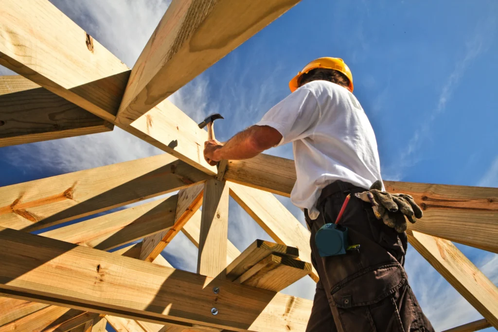 Workers installing the roof frame