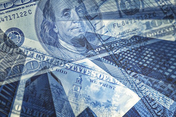 dollar bills on top of downtown buildings