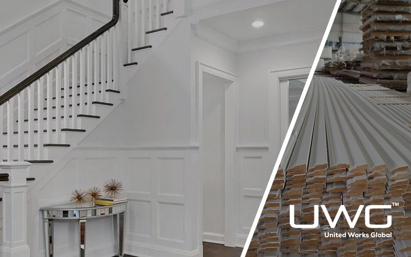 White interior staircase with wall paneling and matching door casings