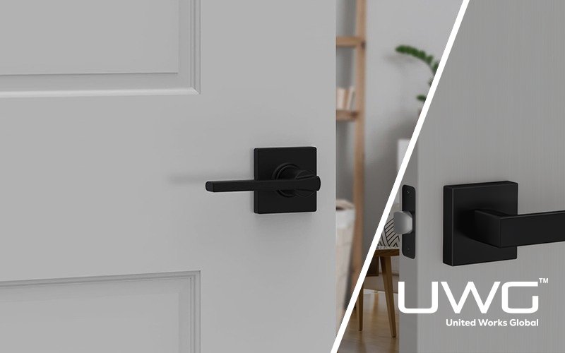 Modern black door handle installed on a white interior door