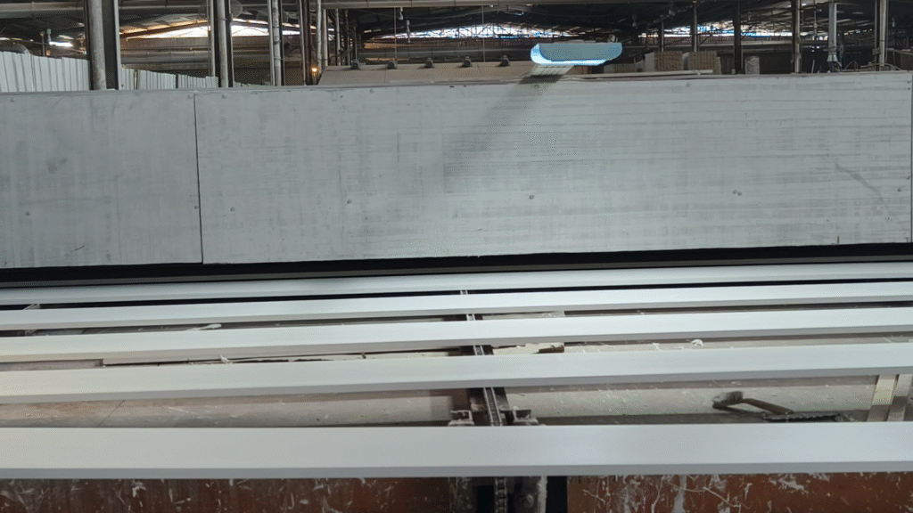 Mouldings primed in the factory, ready for drying.