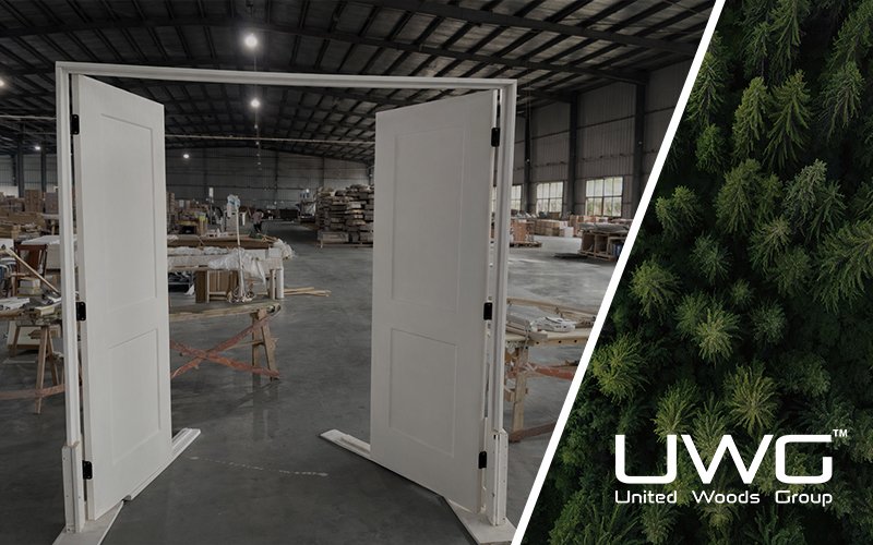 Open white double interior doors in a factory workshop
