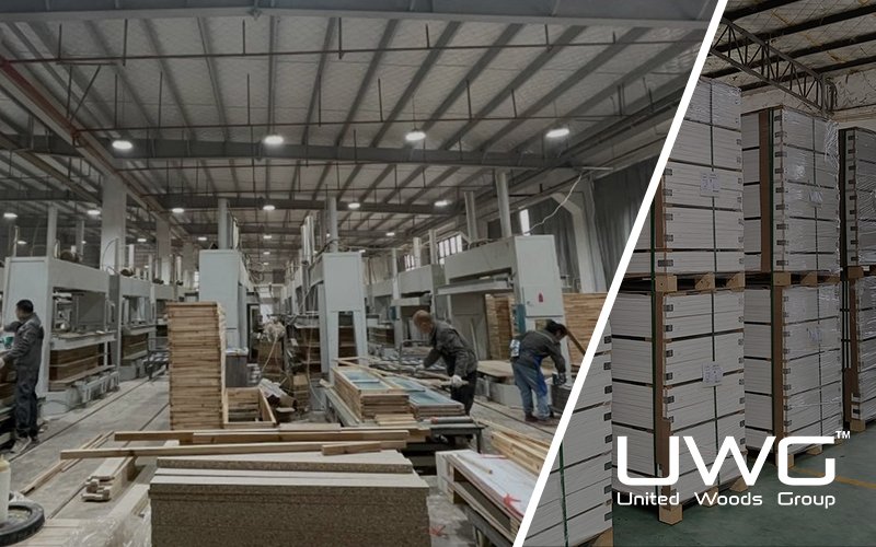 Workers producing wooden doors on machines inside a factory workshop