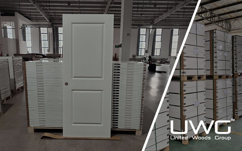 White molded two-panel interior door in a door manufacturing factory