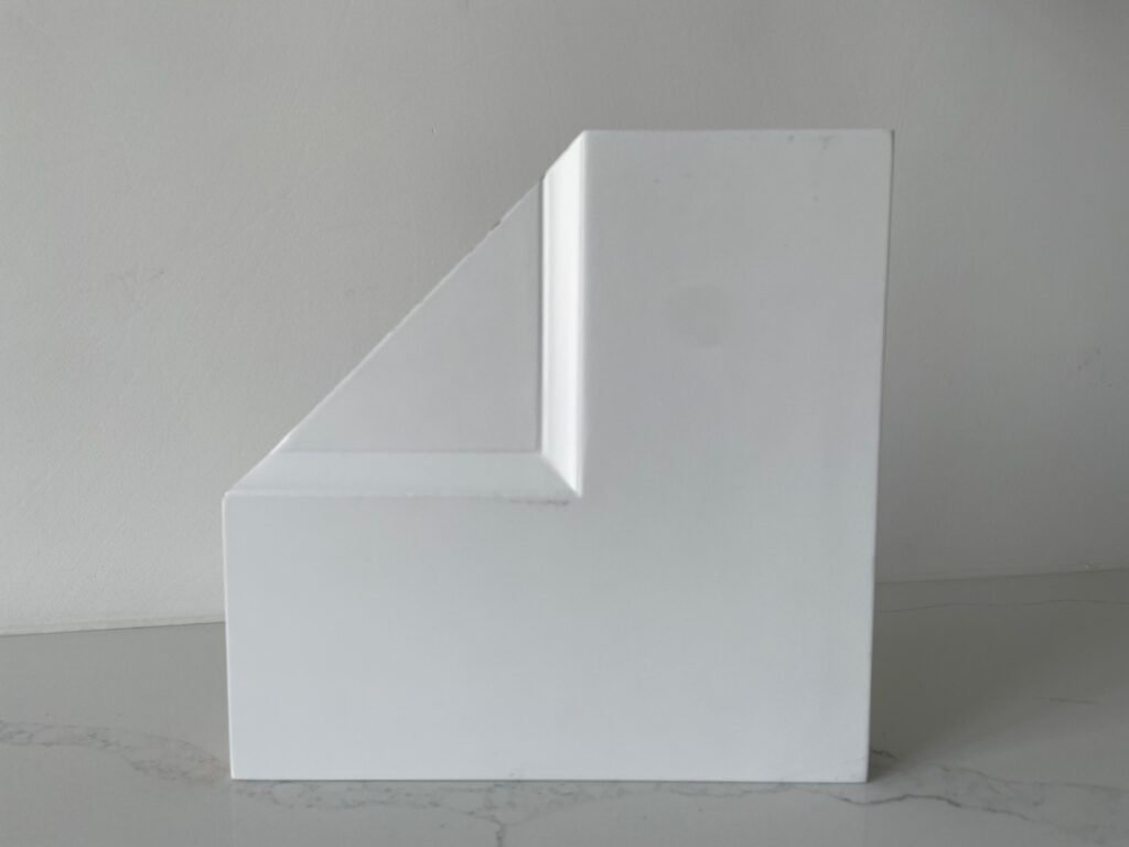 Molded door corner profile with smooth beveled panel transition