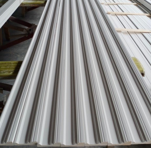 Primed wainscoting panel with rounded groove design