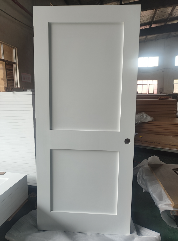 White two-panel shaker interior door in production area