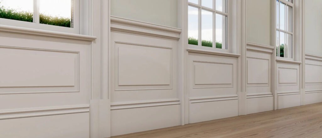 White wall panel moulding with decorative trim and wainscoting in a classic interior.
