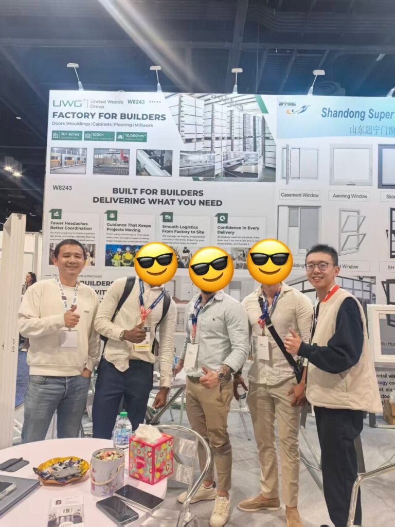 UWG poses for a photo with a client at IBS.