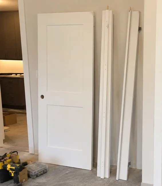 Knock-down interior door slab and frame components packed separately