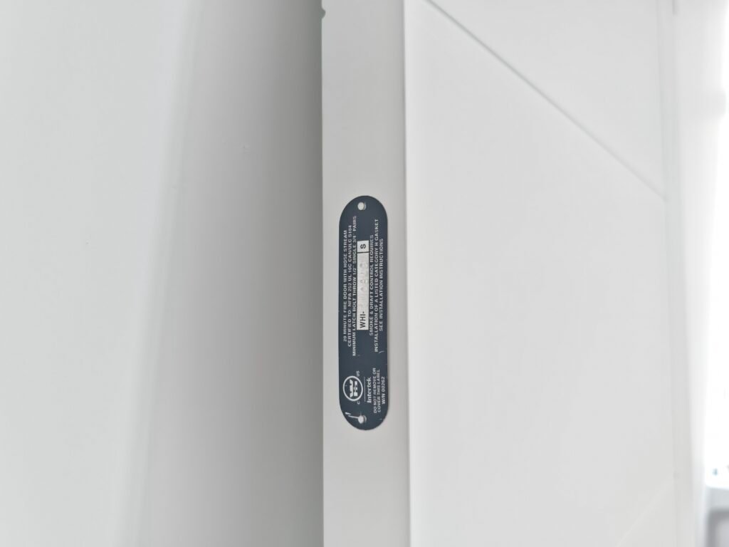 UL 20-minute fire rating label on fire-rated door