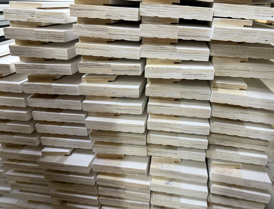 LVL Primed Mouldings Stacked in Factory Warehouse